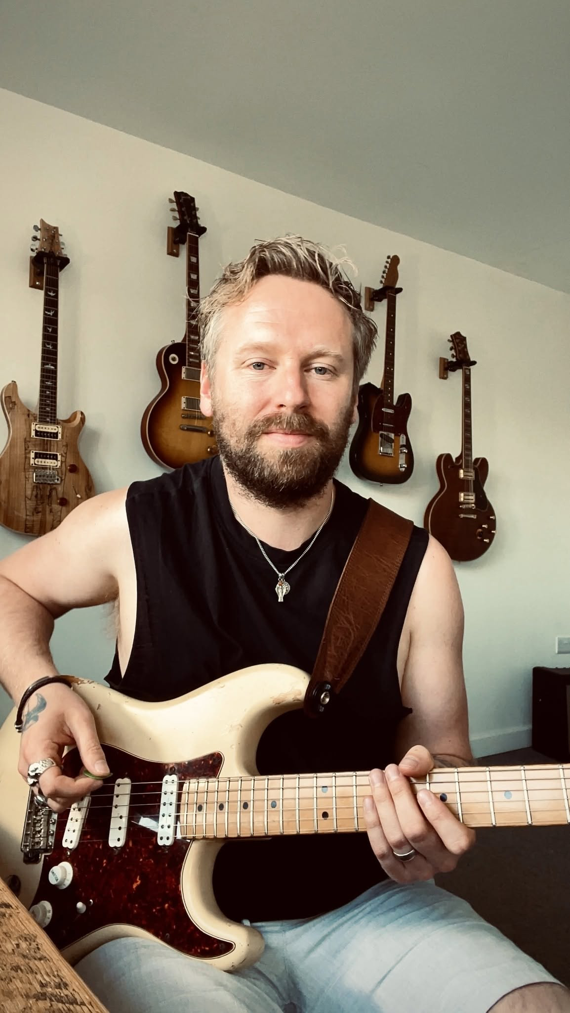 Ben Johnsen at home with his guitars